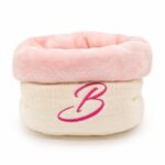 The Bella Nest by Bella's Beauty – soft muslin beauty accessory holder with plush pink lining.